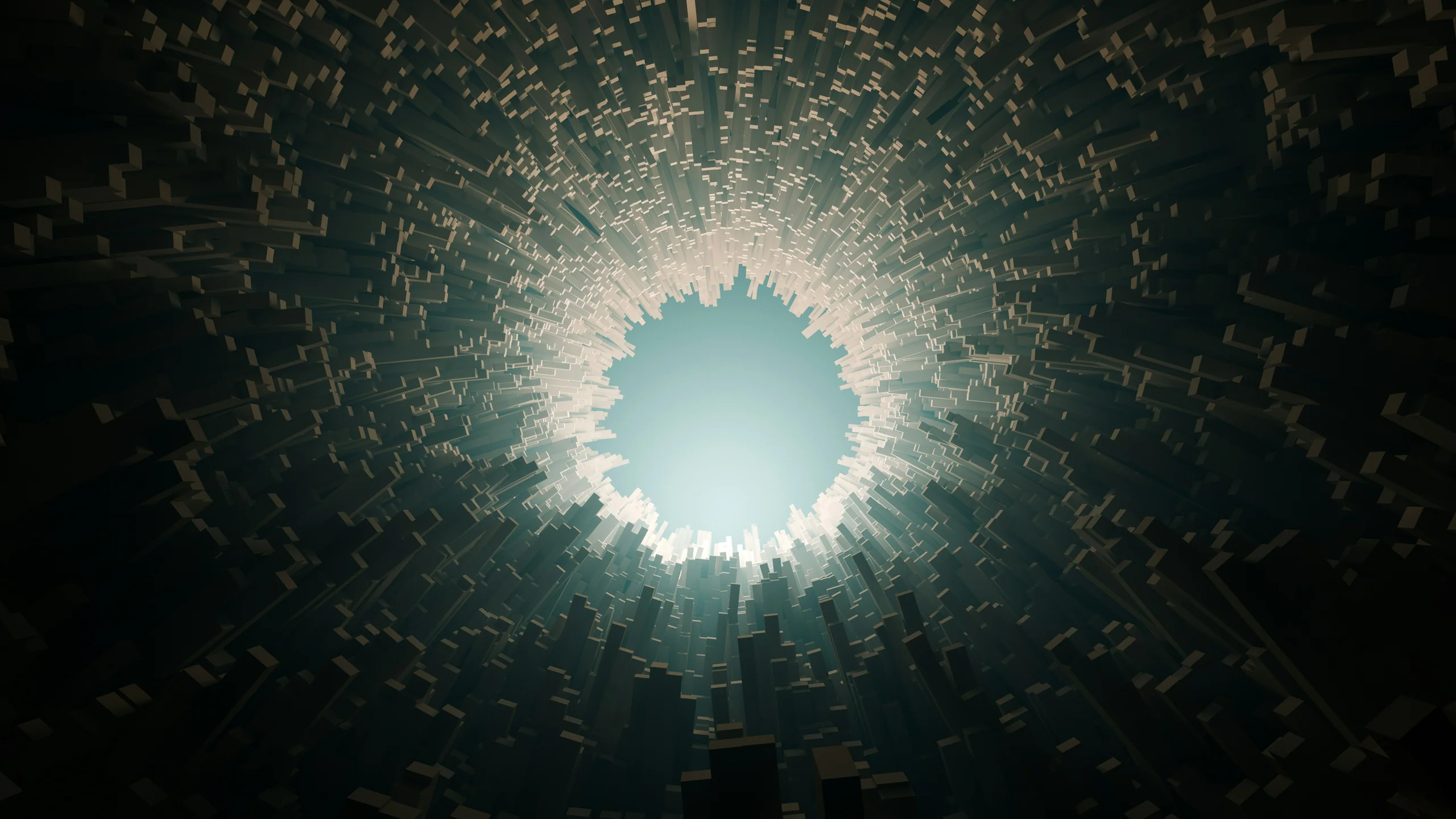 Looking up through a dark rock opening to a bright sky