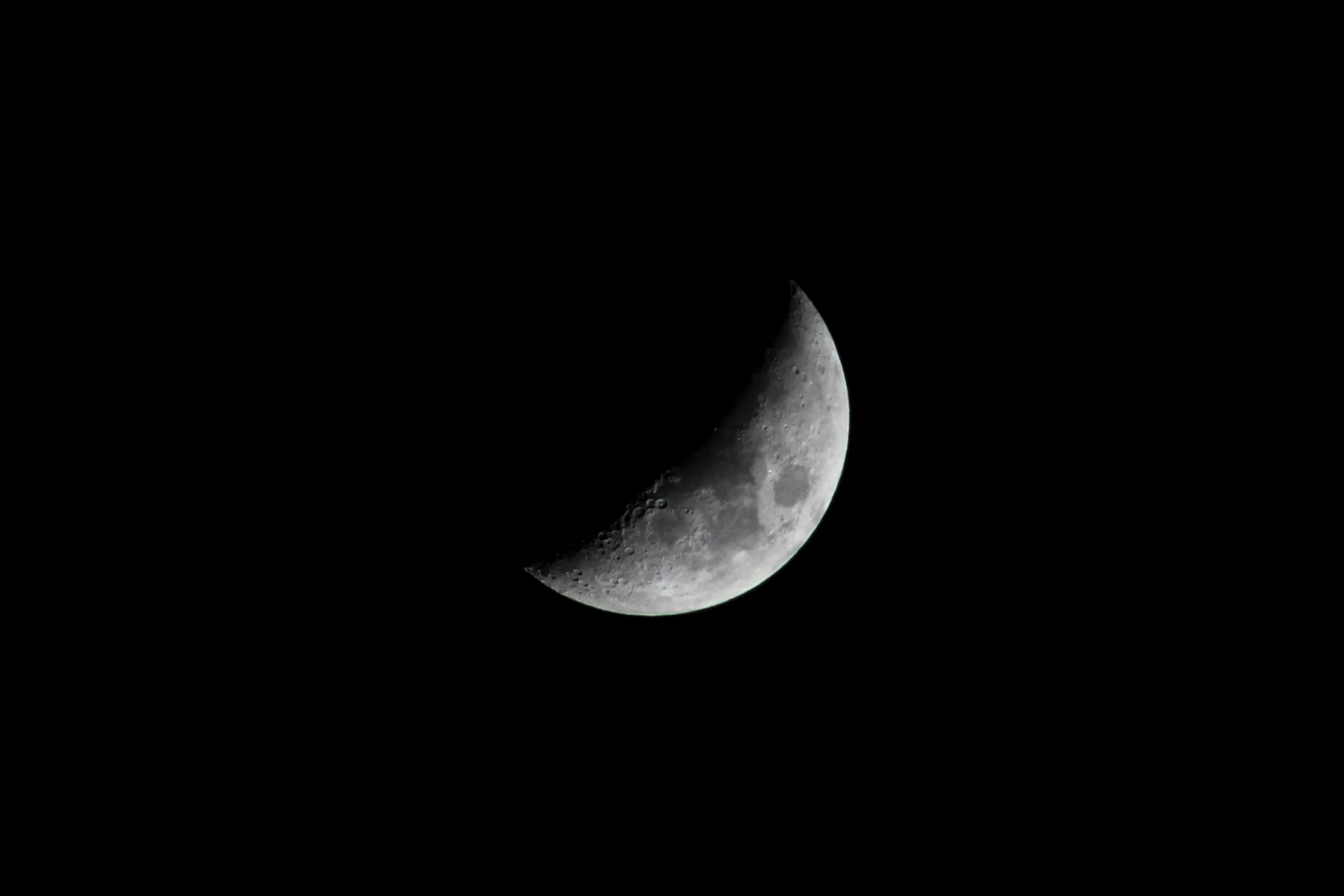 Crescent moon in a black night sky
