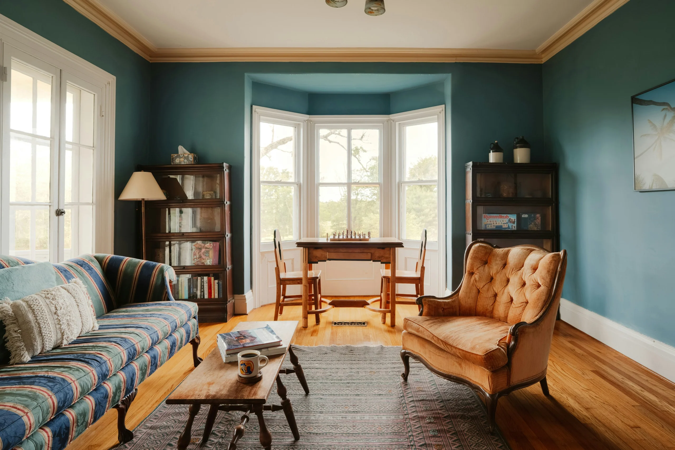 Vintage living room with a leather armchair and bay windows